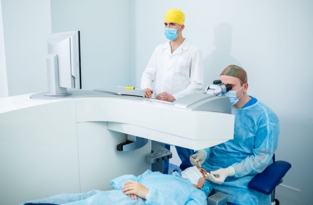 A surgeon carefully performs a patient's LASIK surgery.
